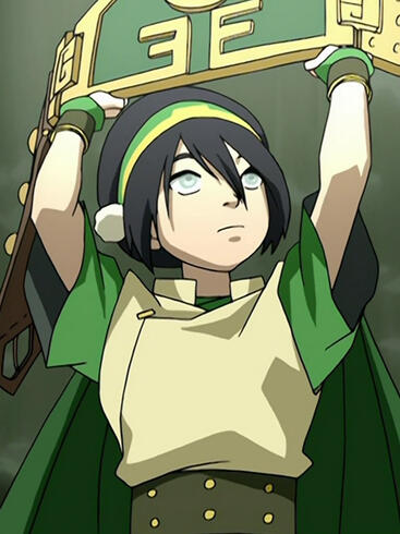 Toph Beifong holding up her earthbender fighting belt